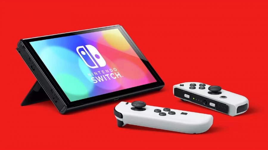 A Nintendo Switch OLED model against a red background