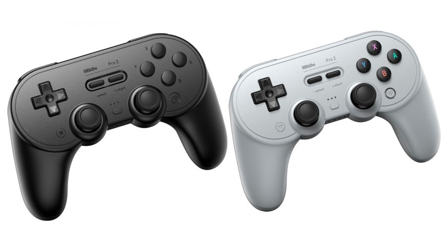 Two 8BitDo Controllers on a white background, one black, one grey.