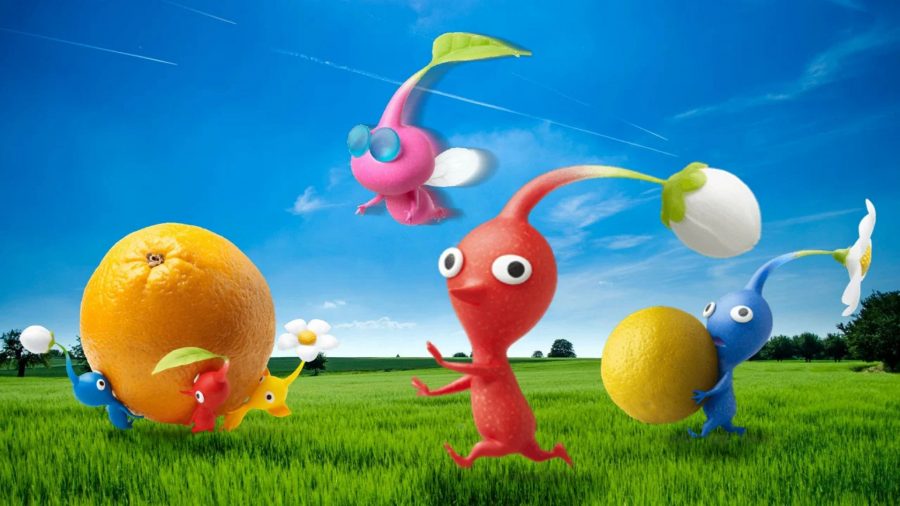 A group of Pikmin rolling fruit through a field