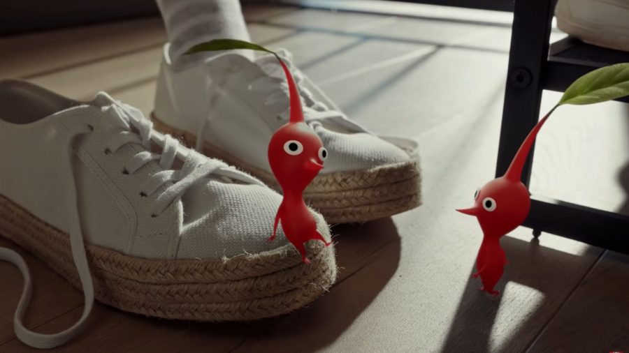 Pikmin Bloom flowers; Pikmin sat on the player's shoes waiting to go on a walk