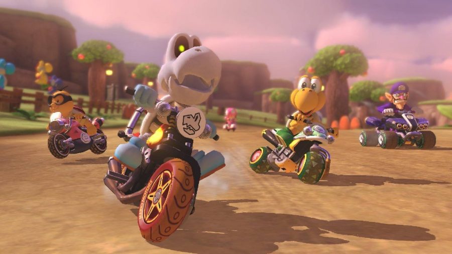 A dry bones is riding a bike in a match of Mario Kart