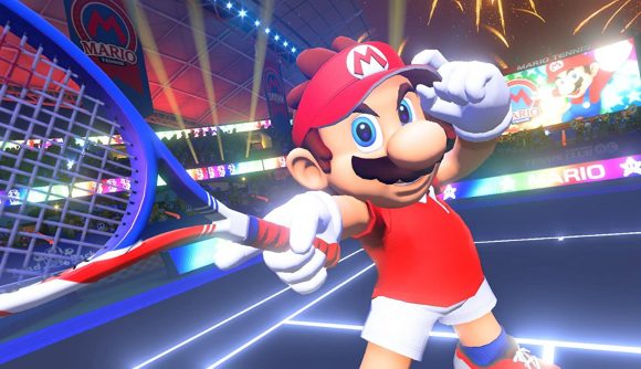 Mario holding his hat and pointing his racket