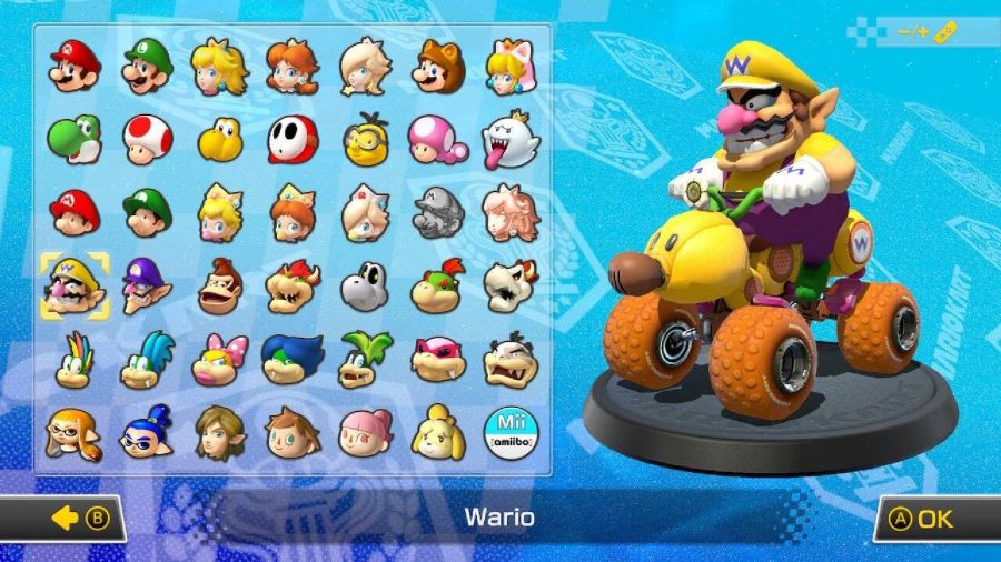 Wario is visible on a character selection screen, sitting in a kart