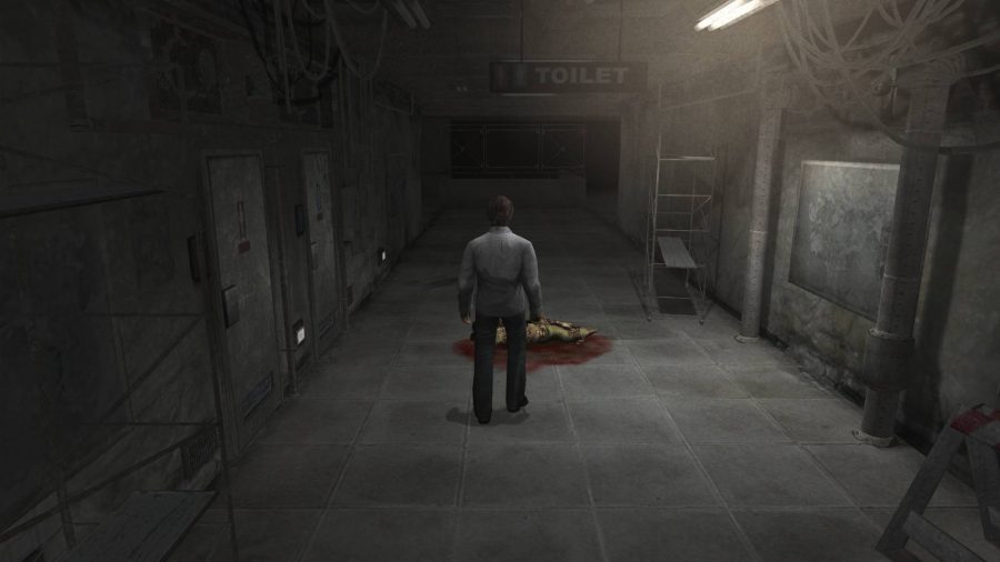 A man stands in a dark, ominous room 
