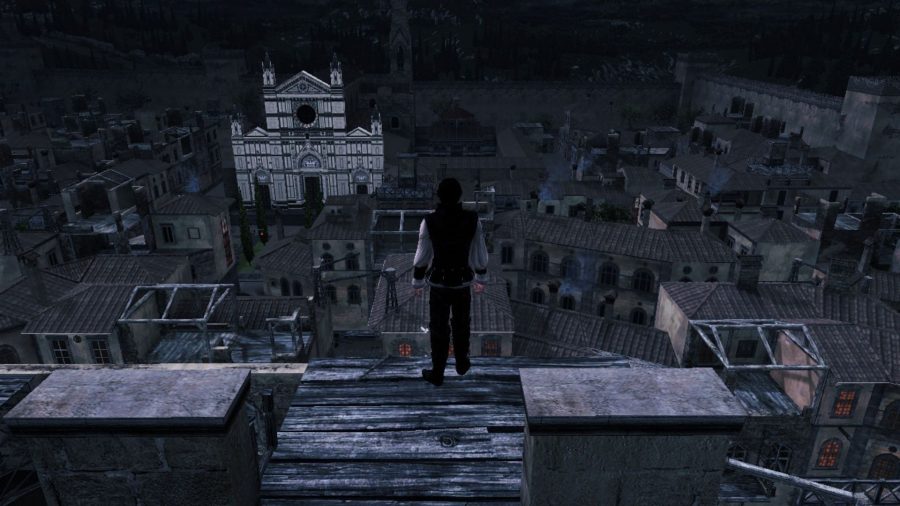 Ezio standing on a very tall building surveying the land at night in Assassin's Creed II