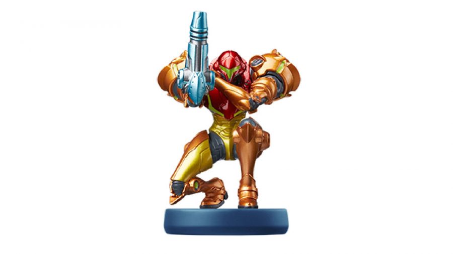 Samus Aran stands poised on one knee - in amiibo form - is visible against a white background 