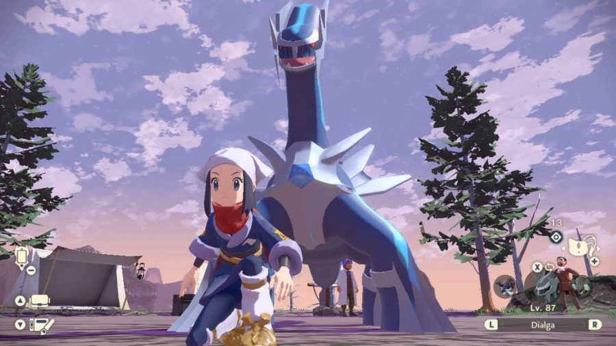 Dialga standing behind a trainer
