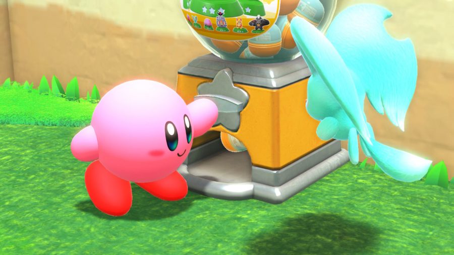 Kirby playing with the gachapon machine