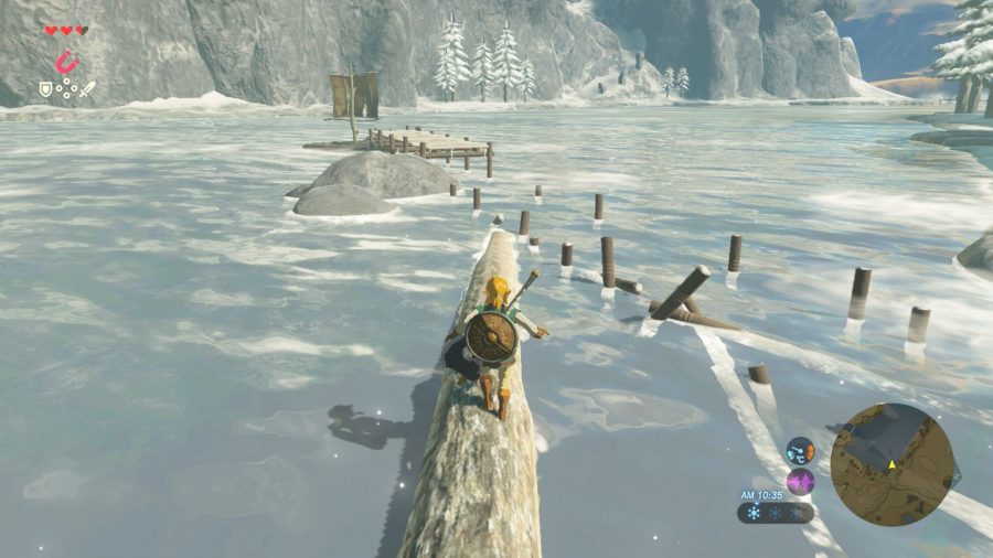 Link from Breath of the Wild tentatively walking across a log floating in a lake.