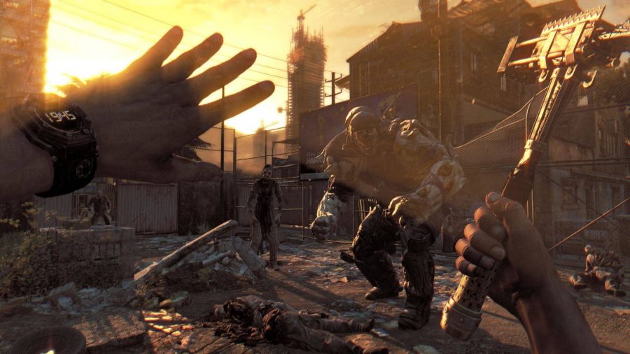 A survivor holding his hand up while zombies approach