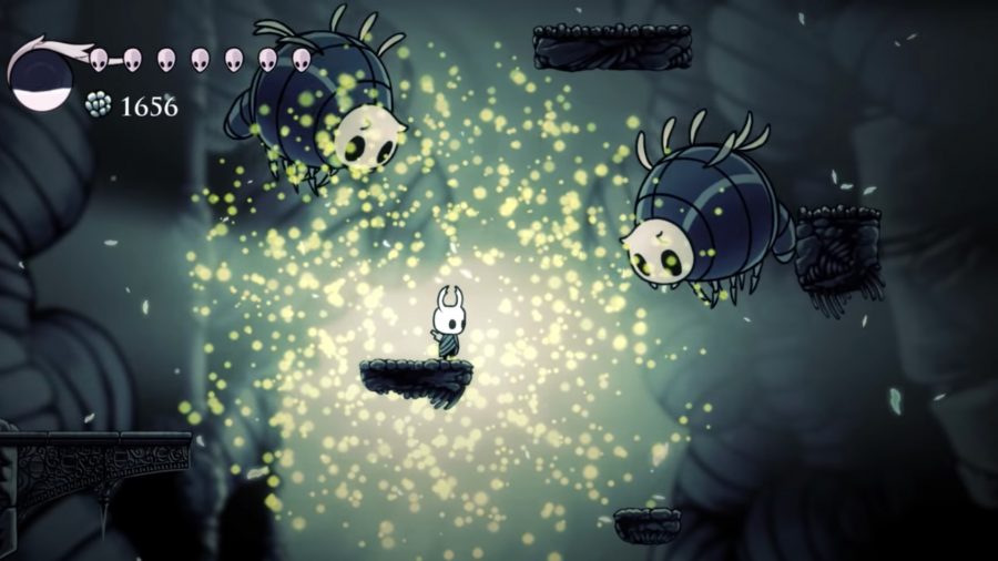 The hero of Hollow Knight facing off against enemies