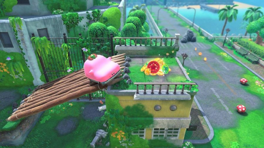 Kirby takes on the shape of a car and drives up a platform to get coins