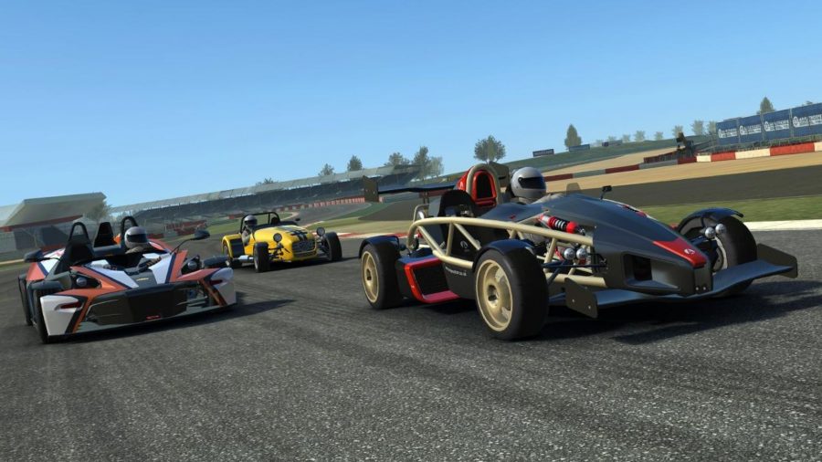 A screenshot from Real Racing 3 showing an Ariel Atom and two other cars racing around a track.