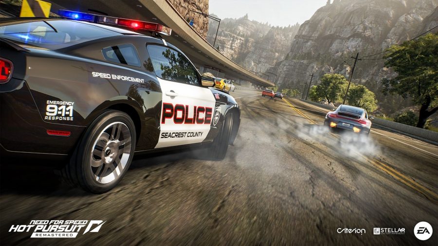 A police car chases down a sports car on a highway in one of the many car games Need for Speed Hot Pursuit
