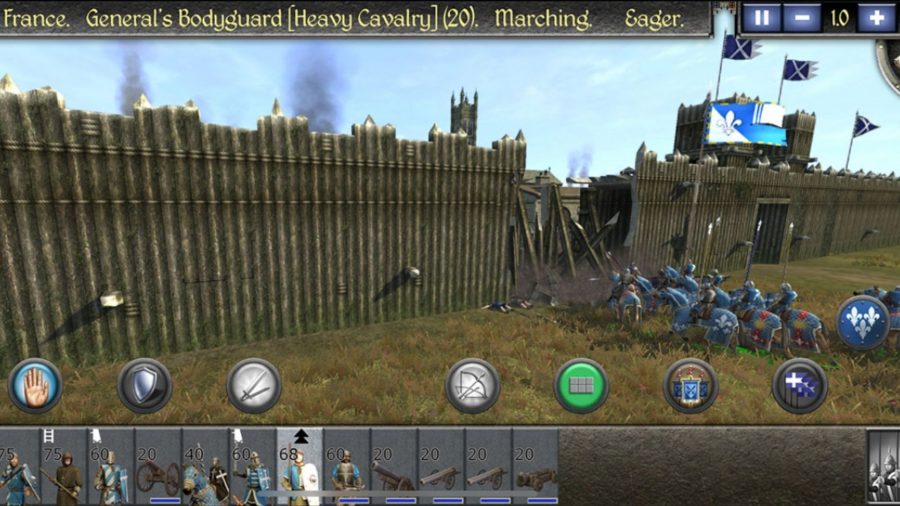 Soldiers break down palisades during a battle in Total War: medieval 2.