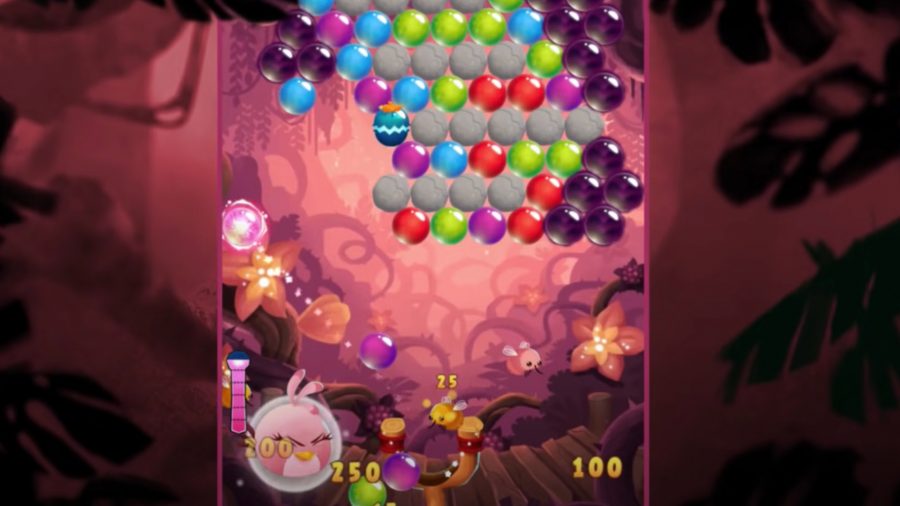 Loads of bubbles next to a pink Angry Bird