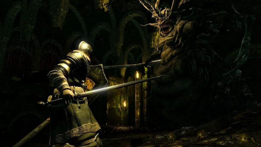 A Dark Souls knight faces up to the Demon Firesage, a giant, bulbous, ugly thing.