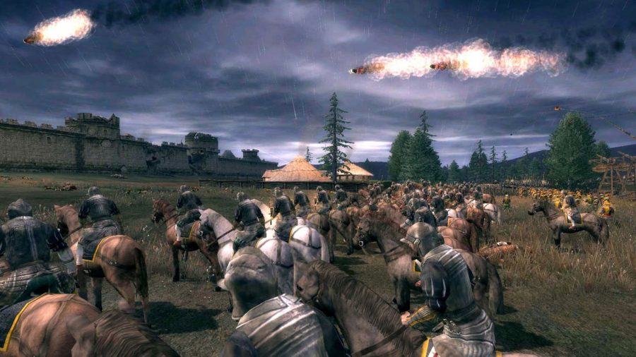 Soldiers on horseback in a field, in a screenshot from Medieval 2 Total War. A fireball flies over their heads.