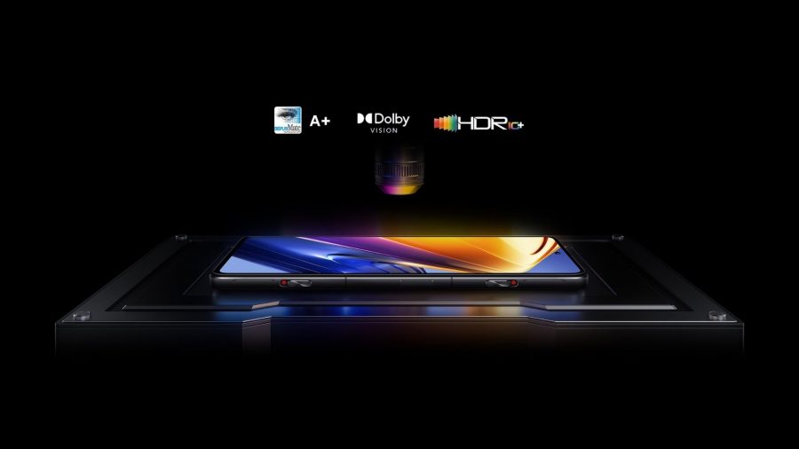 The Poco F4 GT lay on its back, screen background showing, with logos for Dolby Vision and HDR10+ floating above it.