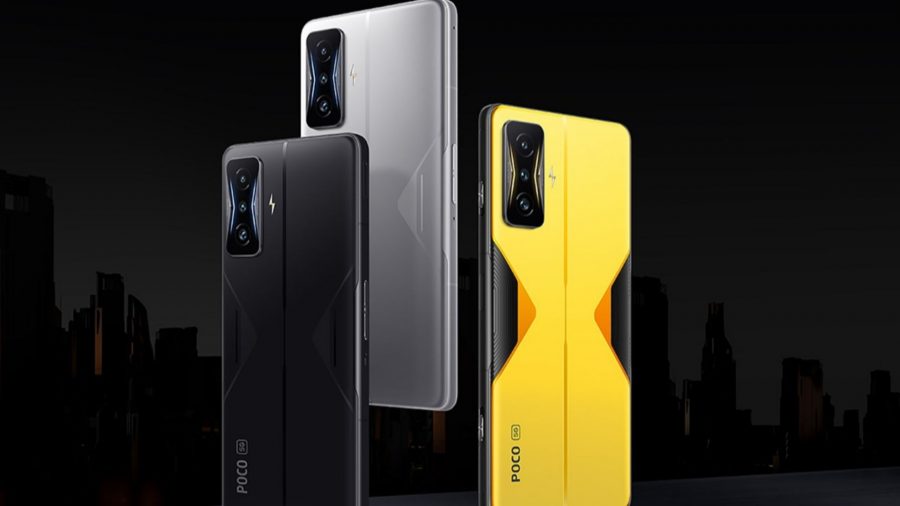 Three Poco F4 GT phones floating on a black background, with the back of the phone showing.  One is yellow, one silver, one black.