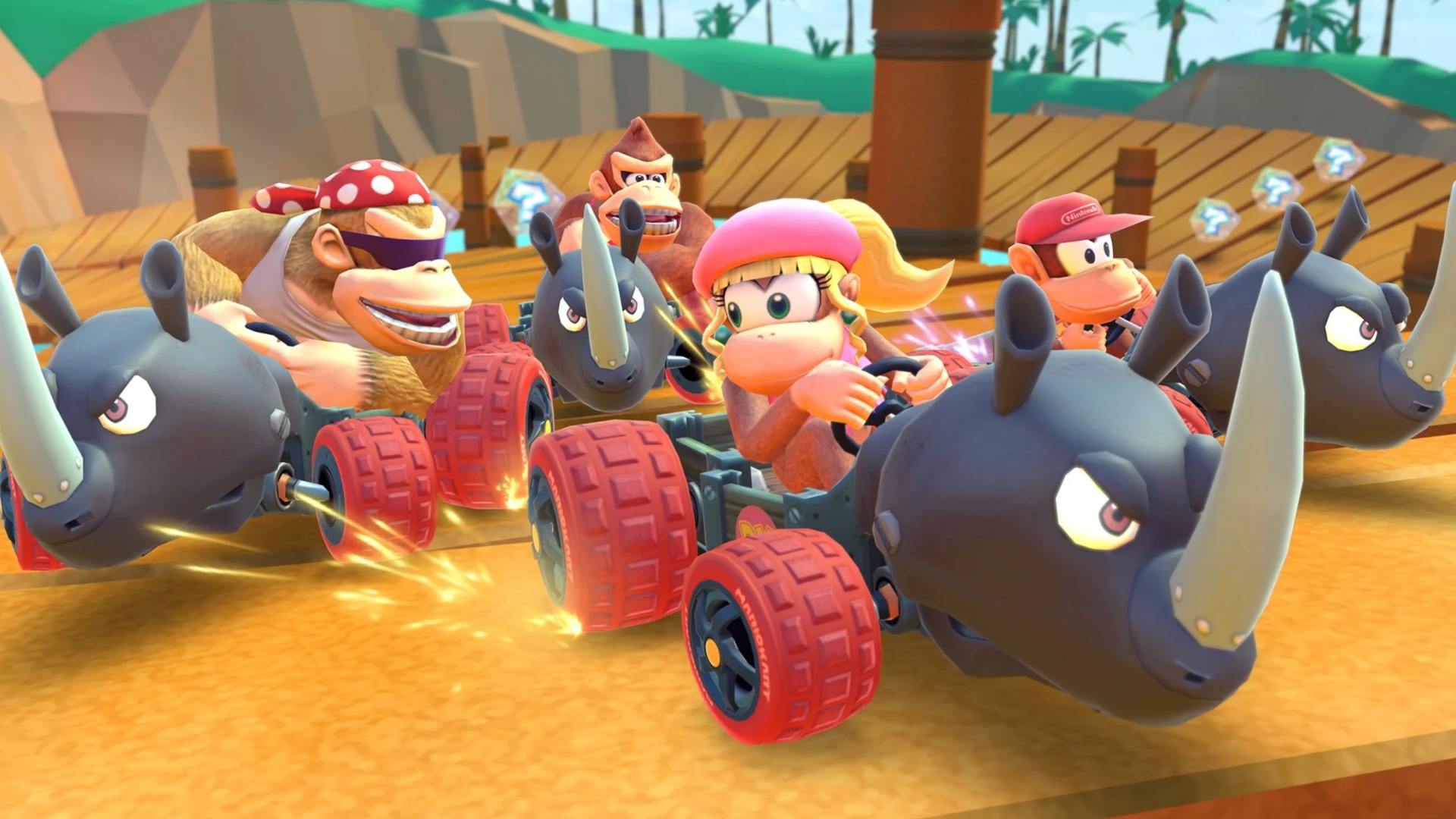 Addictive games - Mario Kart Tour. A screenshot shows Funky, Donkey, Diddy, and Dixie Kong racing in Rambi Riders in the Dino Dino Jungle track. Dixie is in the lead.