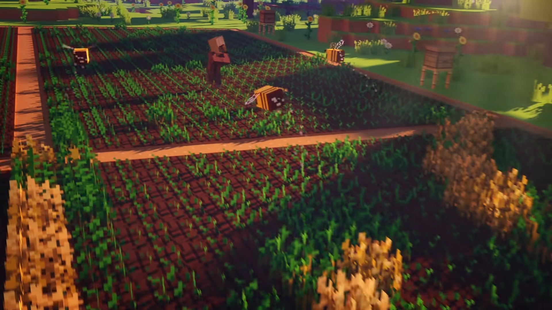Best farm games - Minecraft. A screenshot shows a stretch of farmland with bees flying over and villagers standing amidst it.