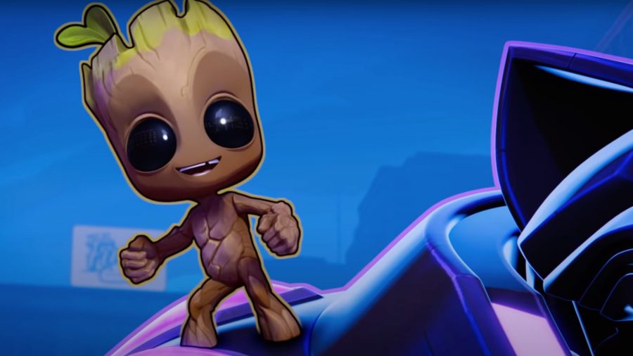 Baby Groot from Marvel Snap (a tiny tree humanoid thing), looking cute standing on someone's shoulder.