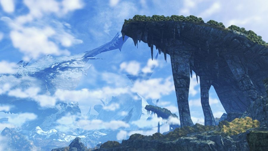 A wide shot from Xenoblade Chronicles 3. There's a large outcrop on the right hand side, propped up by thin natural pillars and covered in grass. Most of the screen is blue sky with spotty white clouds.