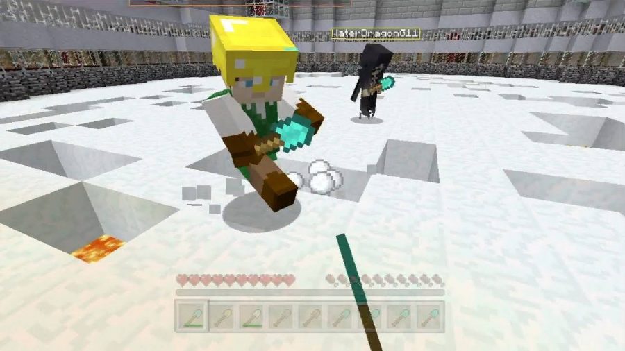 best Minecraft games: a Minecraft minigame is shown where players shovel snow out from underneath each other, dropping them into lava