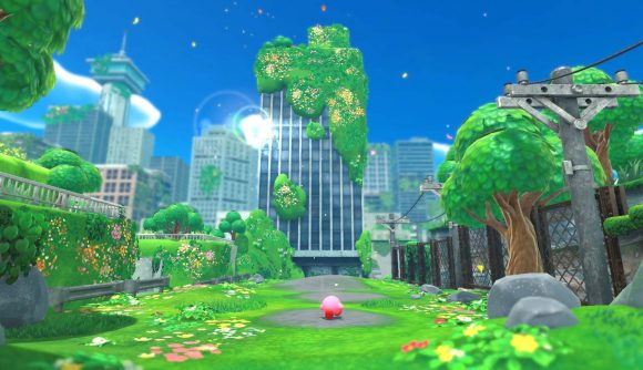 Kirby walking down a colourful yet delapidated street with trees and buildings ahead of him and a clear blue sky