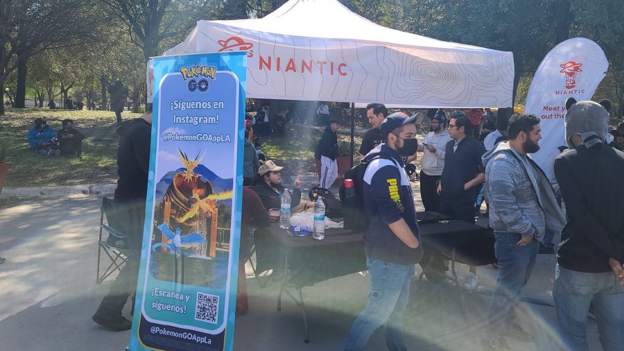Pokemon Go sixth anniversary Niantic interview: several Pokemon Go players are gathered outside for Pokemon Go community day 