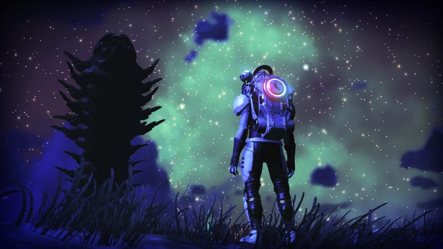An explorer looking at a creature at night on a planet