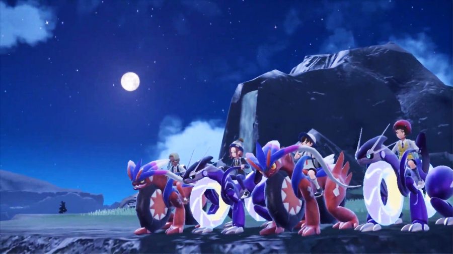 A group of trainers with thei hoverbikes under the moon ready for some Pokemon Scarlet and Violet co-op