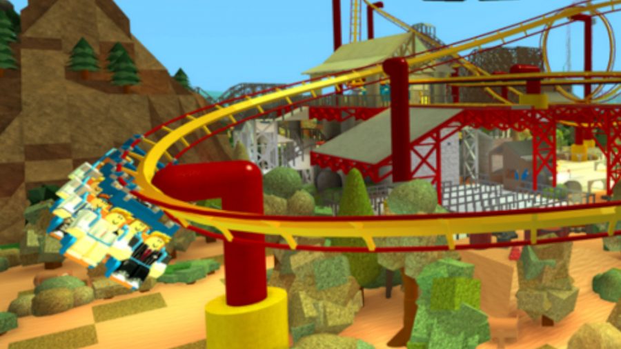 Personajes de Roblox disfrutando de una montaña rusa en Theme Park Tycoon 2